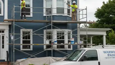 Providence, RI painting crew applying interior paint on a residential wall
